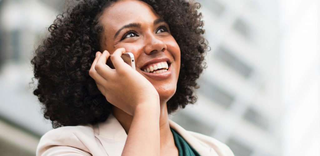 Image of woman with a phone - Contact Page